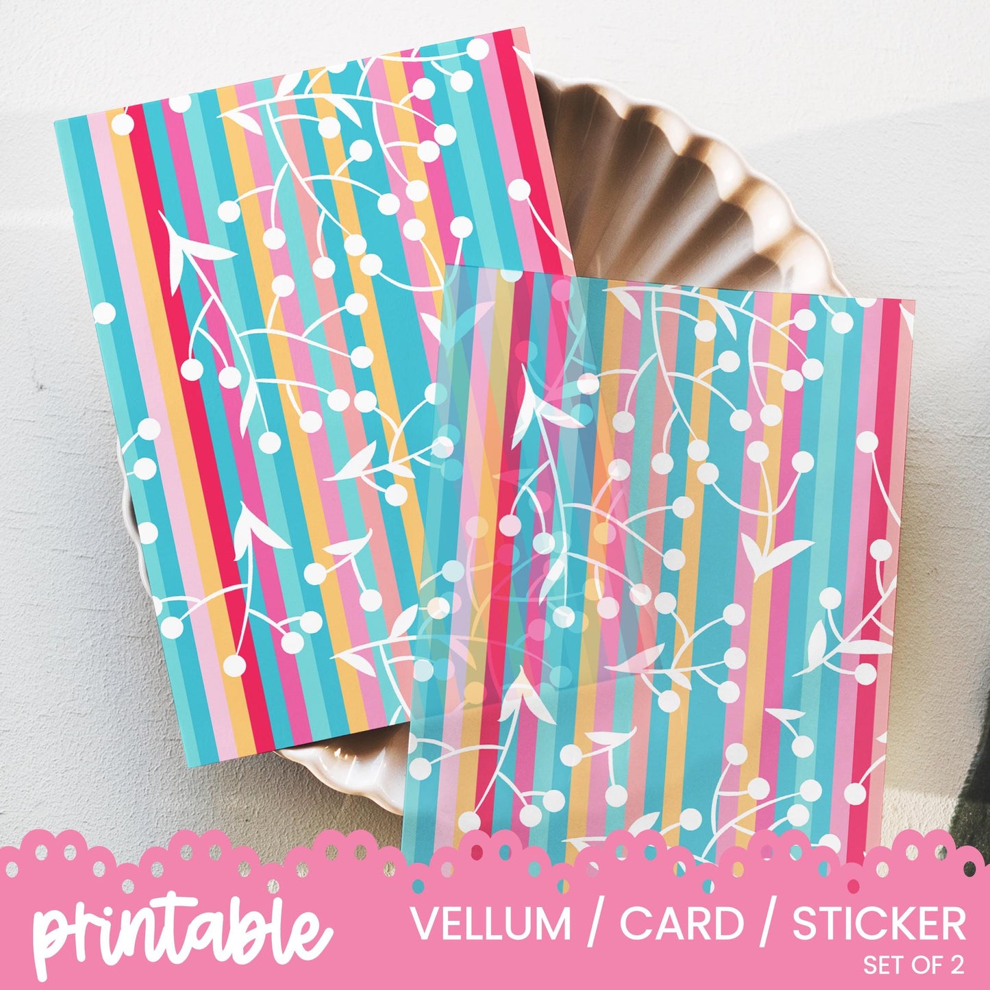 a set of two colorful cards sitting on top of a plate