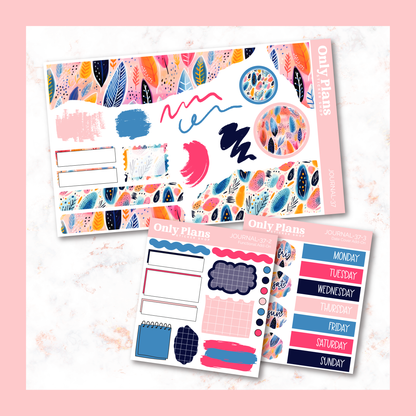 two planner stickers on a marble surface