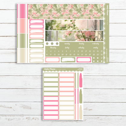 a pink and green planner sticker with pink flowers