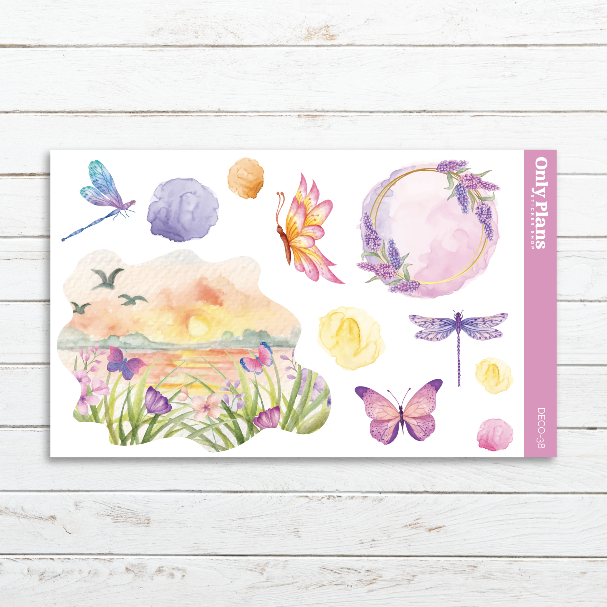 a card with a watercolor painting of flowers and dragonflies