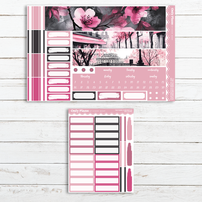 a pink and black planner sticker with pink flowers