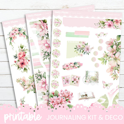 a pink floral planner kit with pink flowers